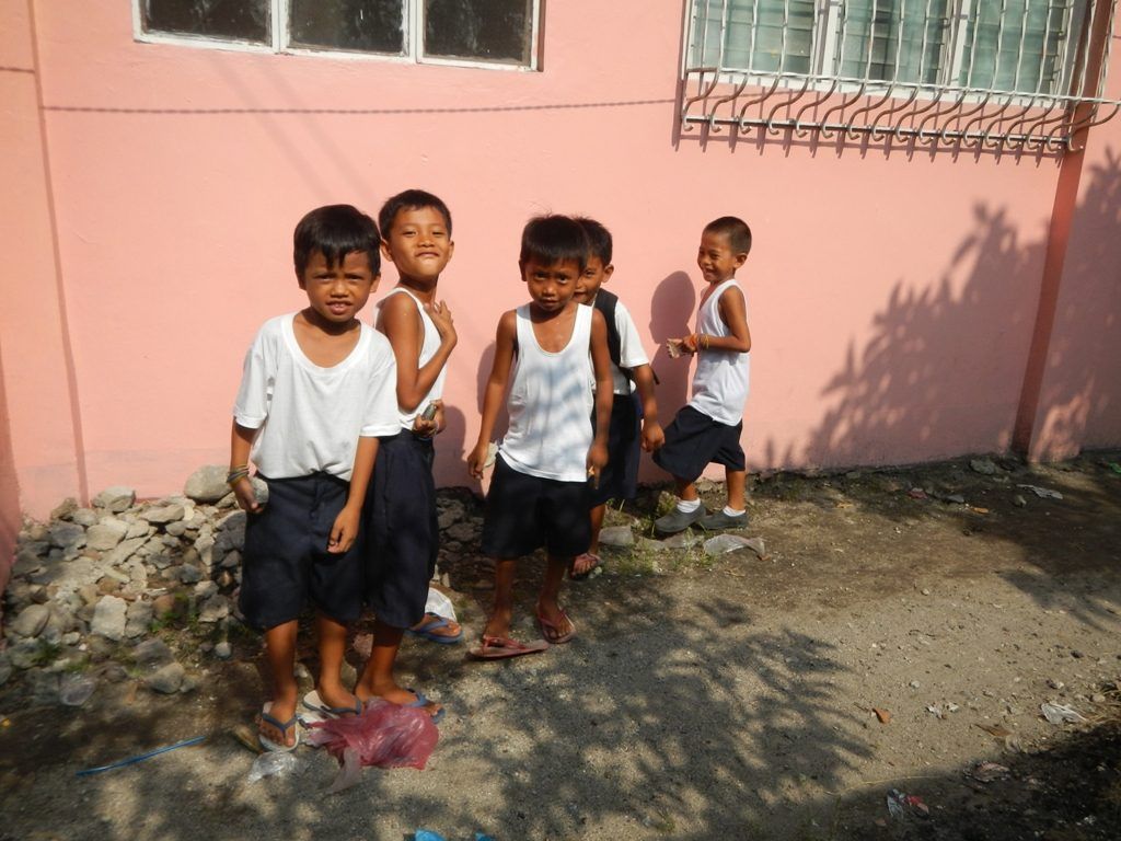 A child in the community talking with others