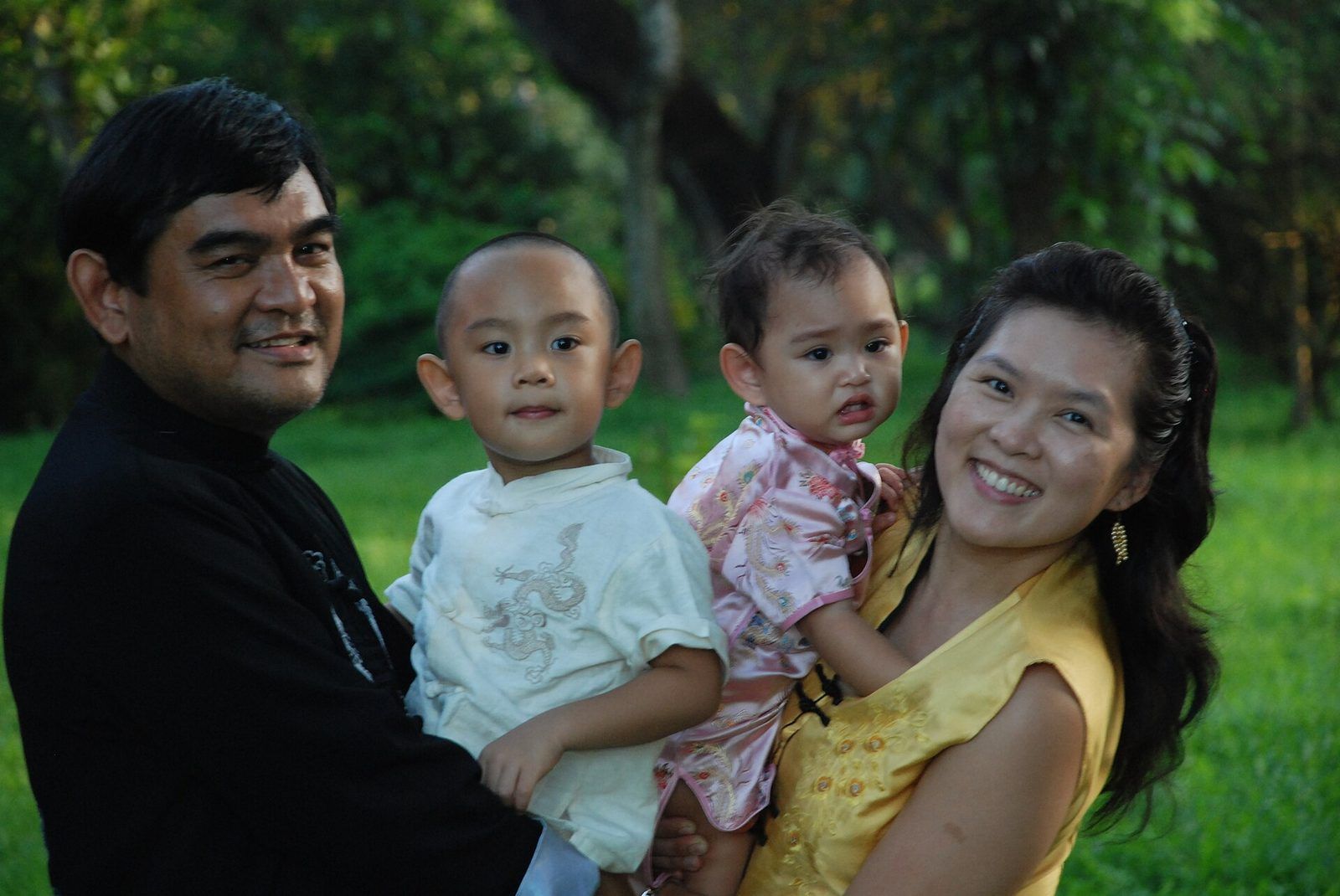 A mother and father with their children